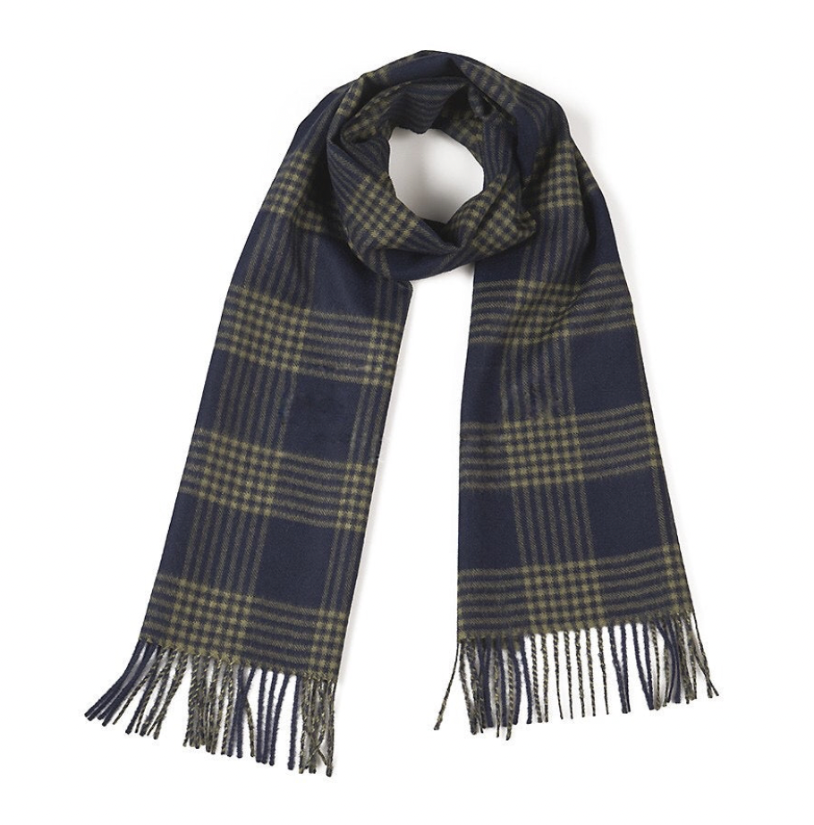 A product photo against a white background of an Alpacas of Montana soft stylish men&#39;s fashion comfortable cozy warm alpaca wool green and navy blue plaid pattern scarf with tassels.
