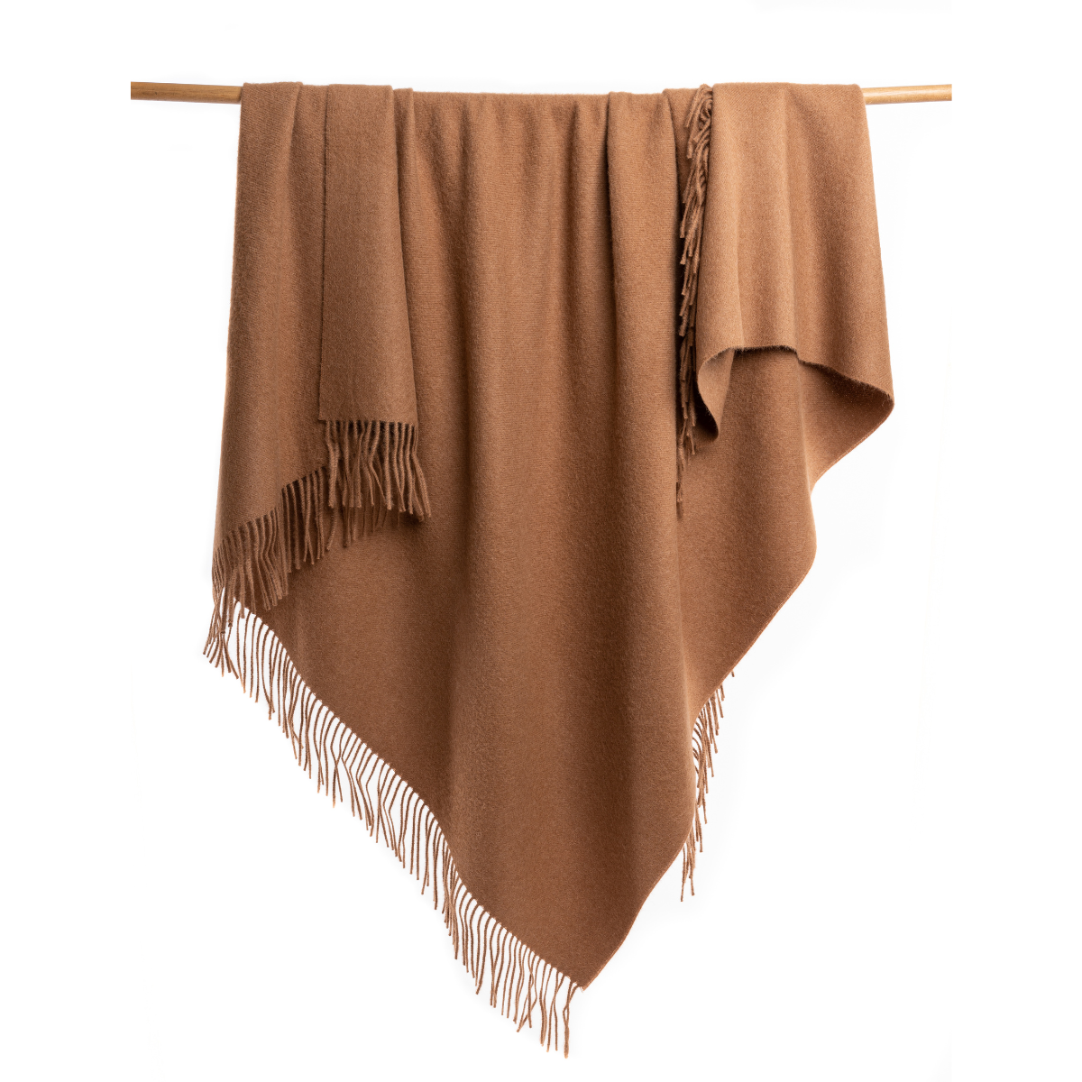 An Alpacas of Montana soft cozy luxury warm gingerbread brown blanket with a tasseled edge.