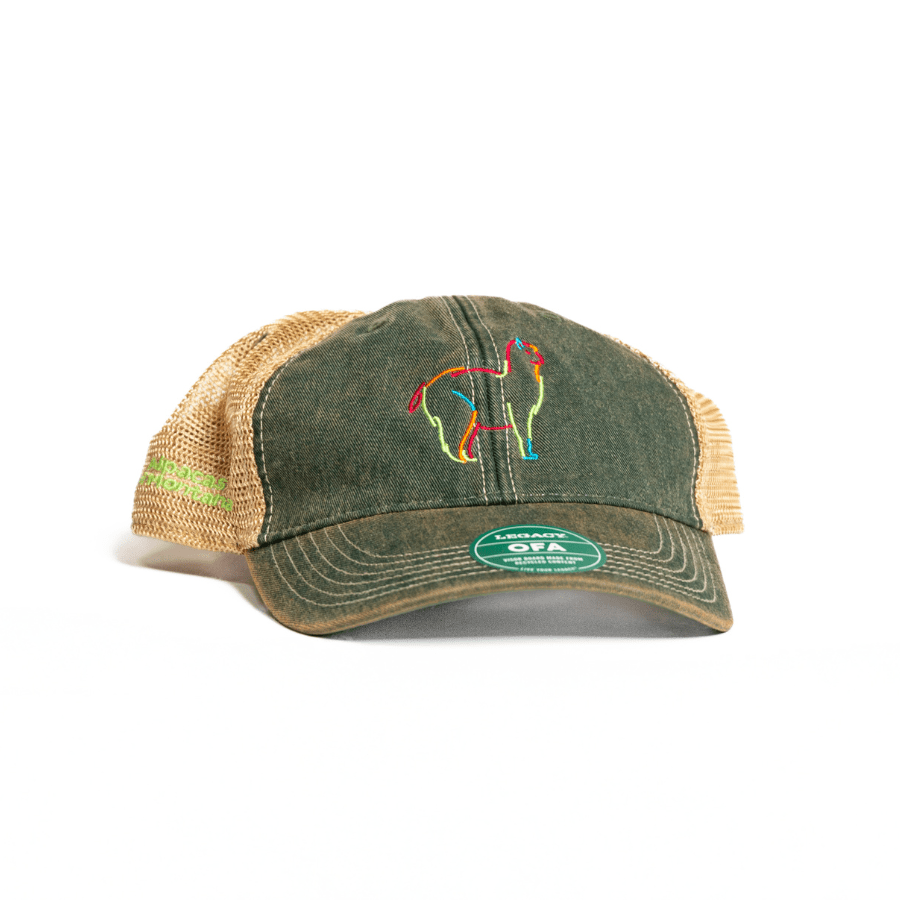 A beige green Nike Sphere Dry baseball cap with FlexFit design, featuring a colorful logo of an alpaca on the front.