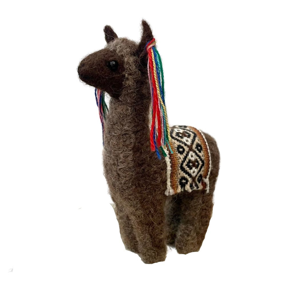 A product photo with a white background of a cute soft adorable gift toy birthday present christmas light and dark brown llama with a woven pattern blanket and colorful ear tassels felted alpaca wool figurine and ornament