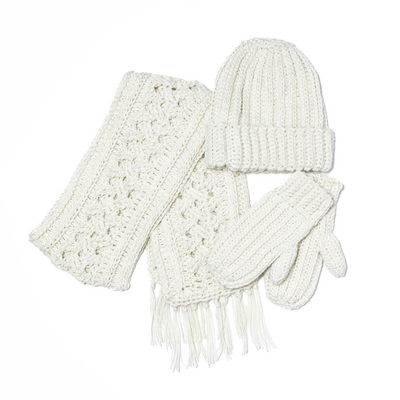 A beige hand-crocheted hat, scarf, and mitten set made from alpaca yarn.