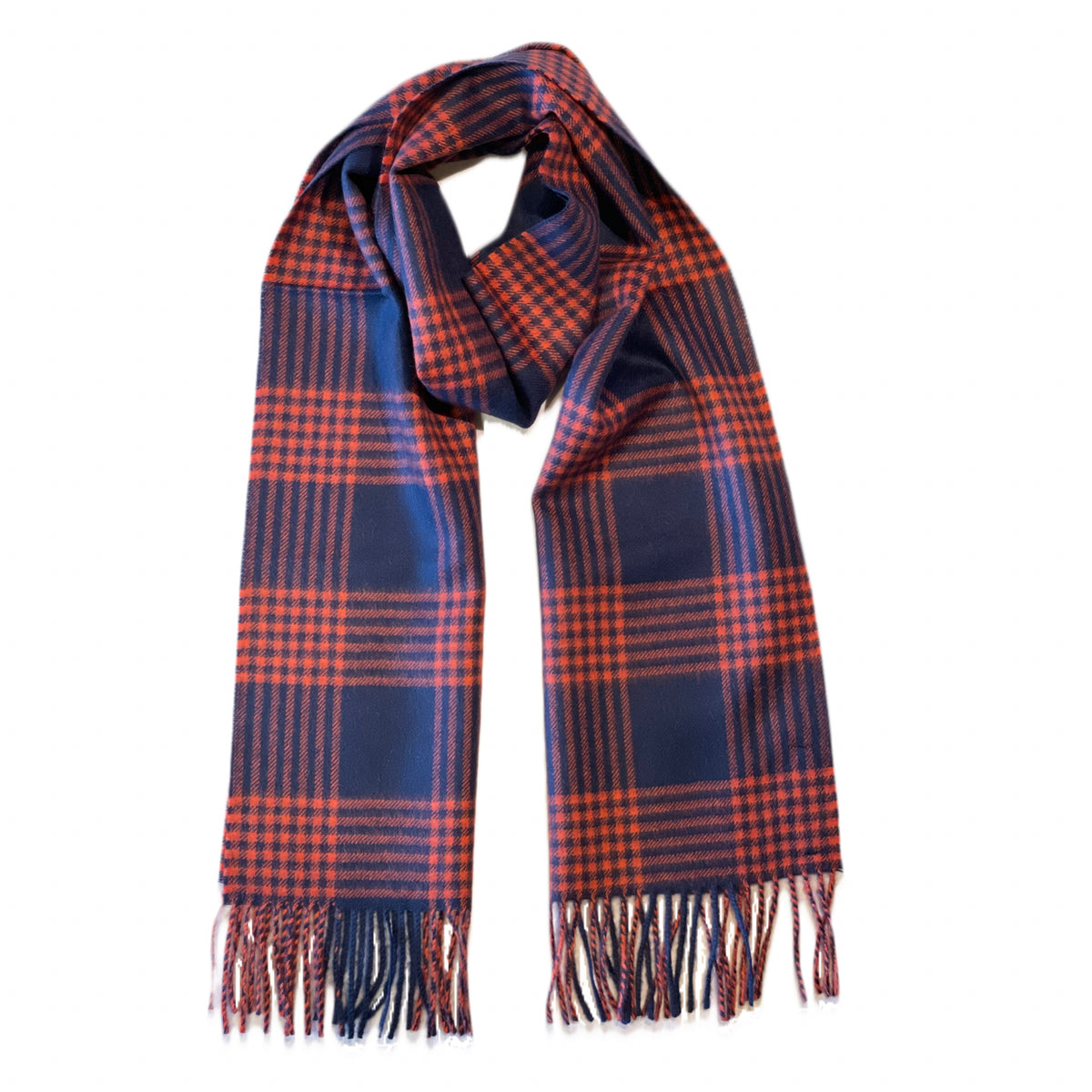 A product photo against a white background of an Alpacas of Montana soft stylish men&#39;s fashion comfortable cozy warm alpaca wool orange red and navy blue plaid pattern scarf with tassels.