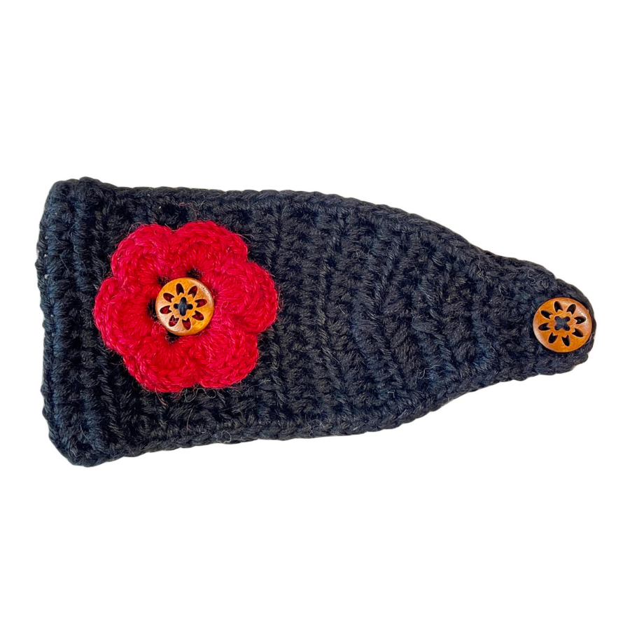 A product photo against a white background of a soft cute stylish fashion cozy comfortable warm winter headband and flower accessory handmade knit crochet in Montana from black and scarlet red alpaca yarn