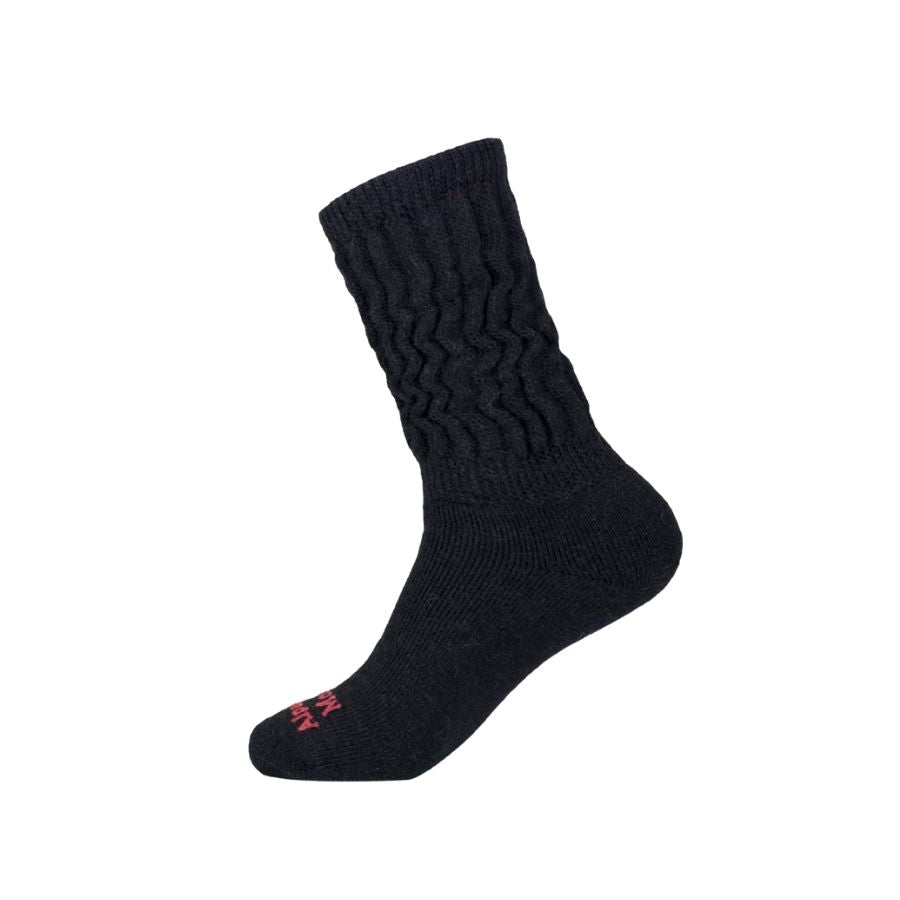 A product photo against a white background of a black Alpacas of Montana soft comfortable cozy lounge breathable moisture wicking antimicrobial therapeutic diabetic loose fit mid-calf sock.
