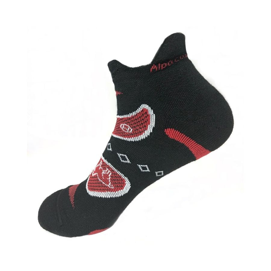 A product photo against a white background of the Alpacas of Montana soft comfortable breathable athletic outerwear activewear moisture wicking black, scarlet red, and white endurance sock for running, sports, hiking, exercise.