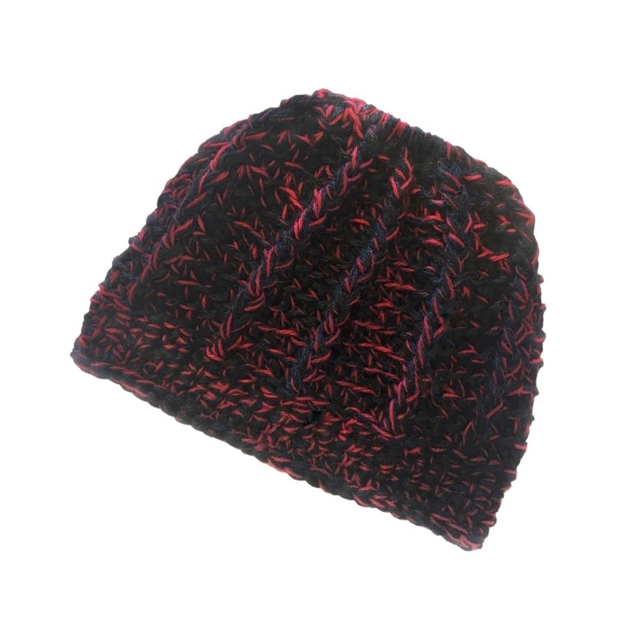 A product photo on a white background of a soft cozy comfortable fashionable moisture wicking knitted crochet ponytail hat handmade in Montana from black and red alpaca wool and bamboo yarn.