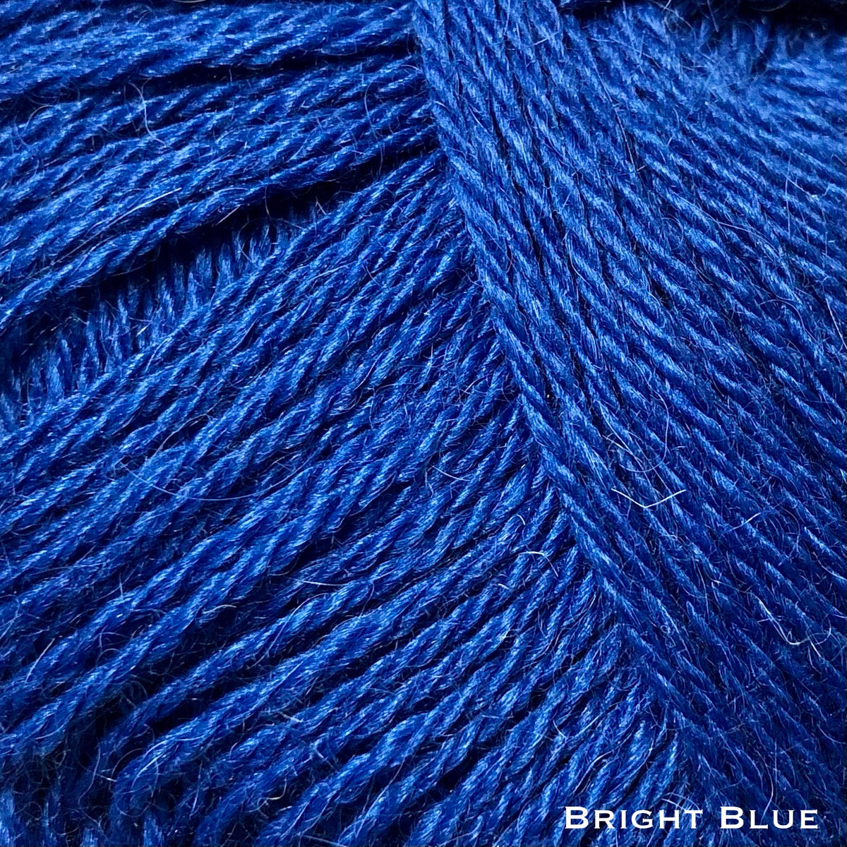 bright blue sport weight alpaca wool natural yarn for knitting and crochet