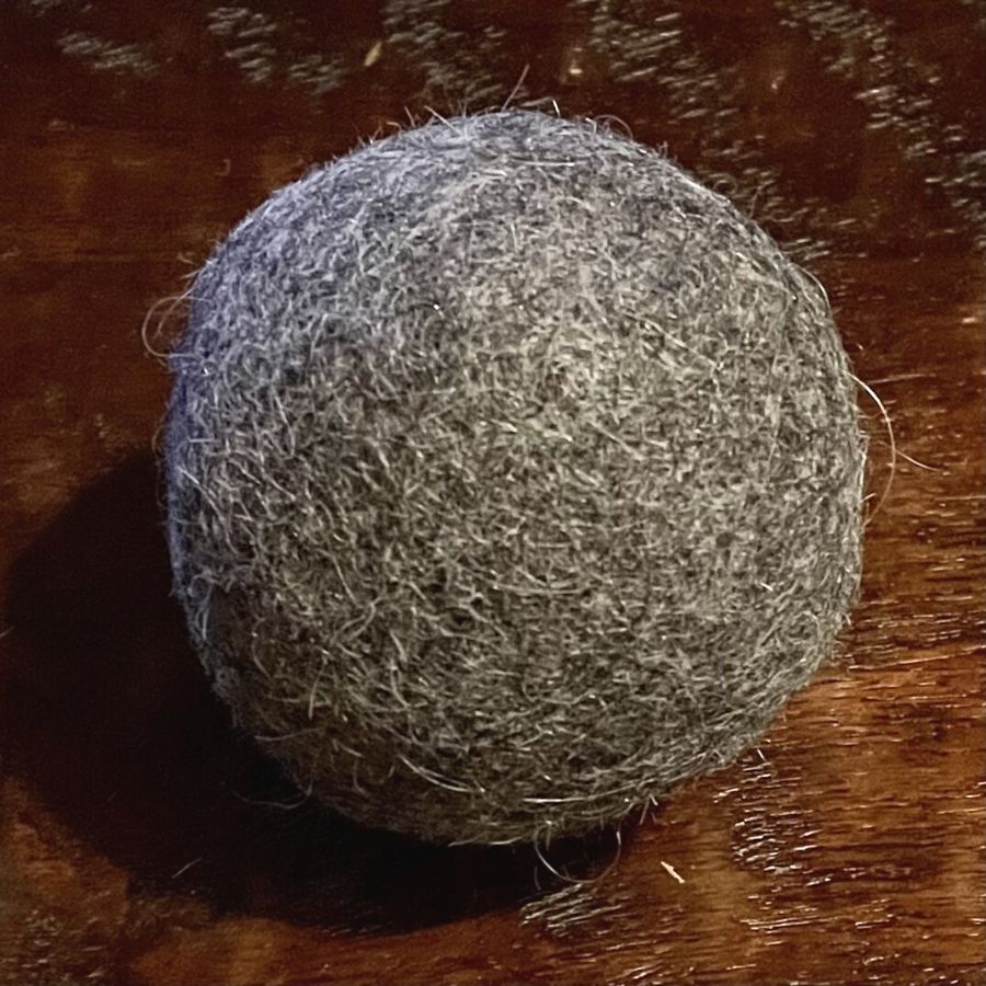gray alpaca wool dryer ball on table