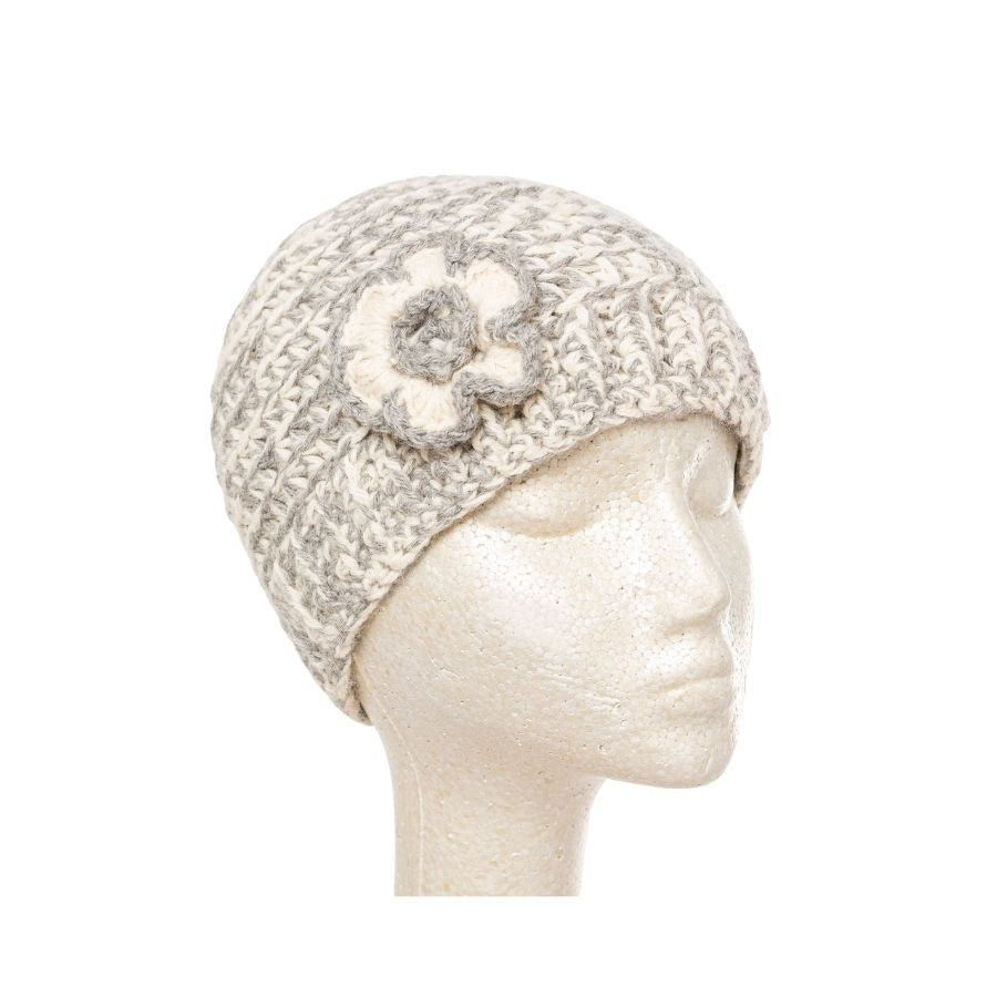 shades of light gray hand knit alpaca beanie hat with flower on mannequin head