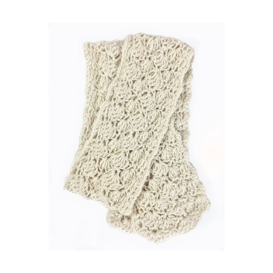 A product photo with a white background of a soft stylish cozy comfortable fashionable moisture wicking knitted crochet scallop pattern scarf handmade in Montana from natural white alpaca wool and bamboo yarn.