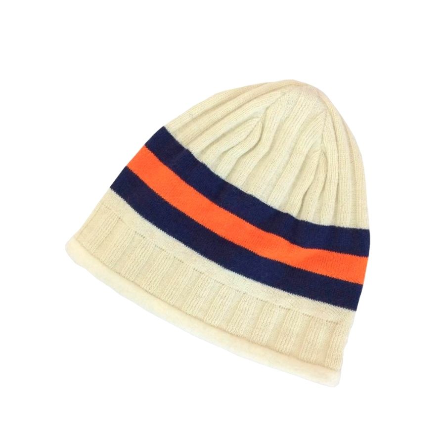 A product photo of the Alpacas of Montana soft cozy comfortable warm winter outerwear hiking skiing moisture wicking natural white, navy, and orange Blue and Orange StripeBackcountry Beanie.
