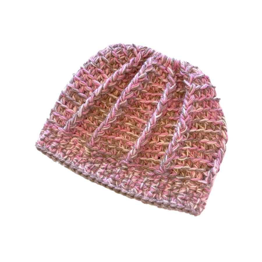 A product photo on a white background of a soft cozy comfortable fashionable moisture wicking knitted crochet ponytail hat handmade in Montana from natural white, latte brown, and light pink blush alpaca wool and bamboo yarn.