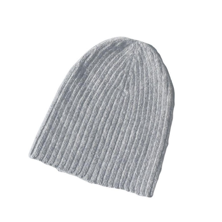A product photo of a soft warm winter cozy moisture wicking comfortable fashionable light gray alpaca wool beartooth beanie with no pom pom.