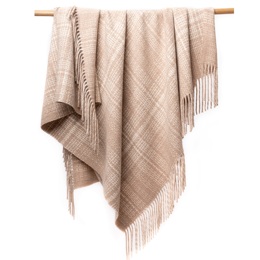 An Alpacas of Montana soft cozy luxury warm chestnut brown with natural white accent heather plaid blanket with a tasseled edge.