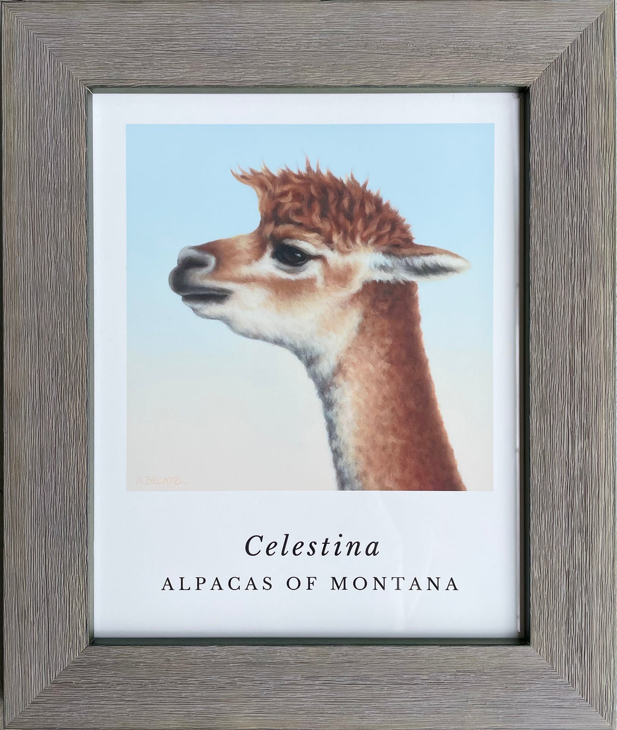 A framed alpaca portrait painting of a brown and gold alpaca