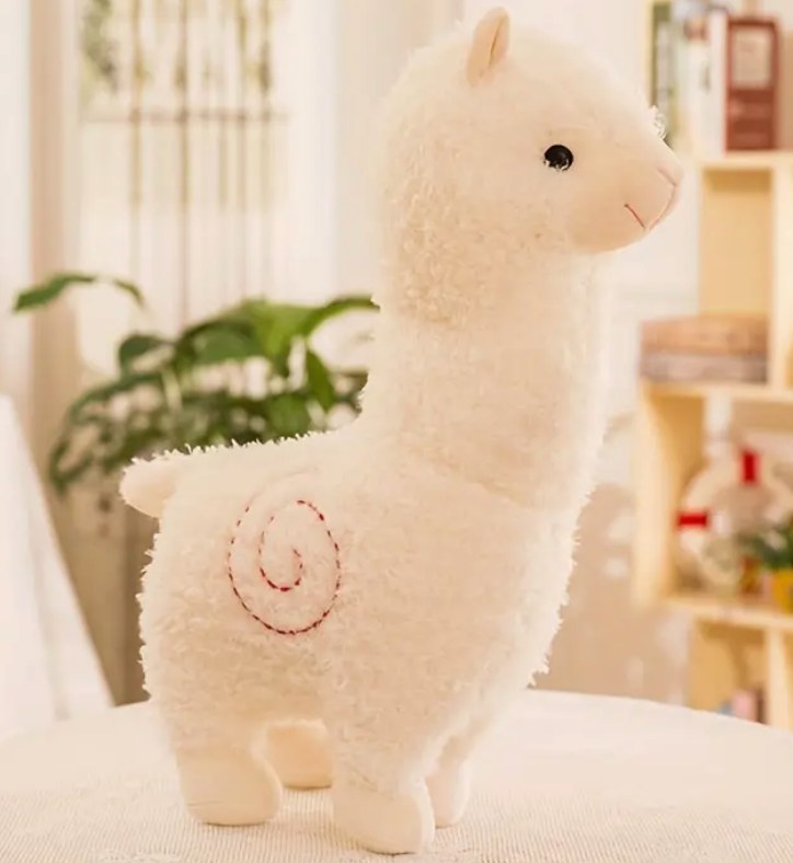 A photo of a soft cute adorable kids toy best friend smiling fluffy plush white alpaca plushie with a colorful swirl on its side for children gifts birthdays