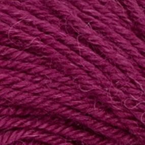 Close-up of a ball of dark purple yarn mulberry in color