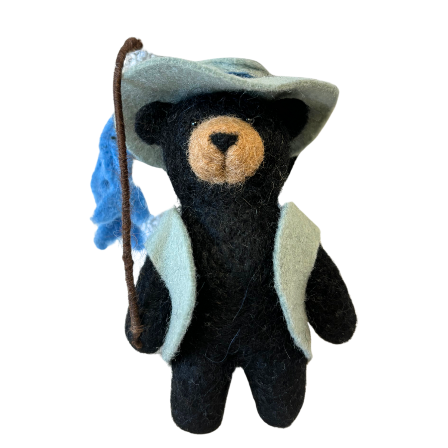 Black bear felted ornament made from alpaca fleece wearing a fishing vest, fishing hat, a fishing pole and two felted alpaca fish.  