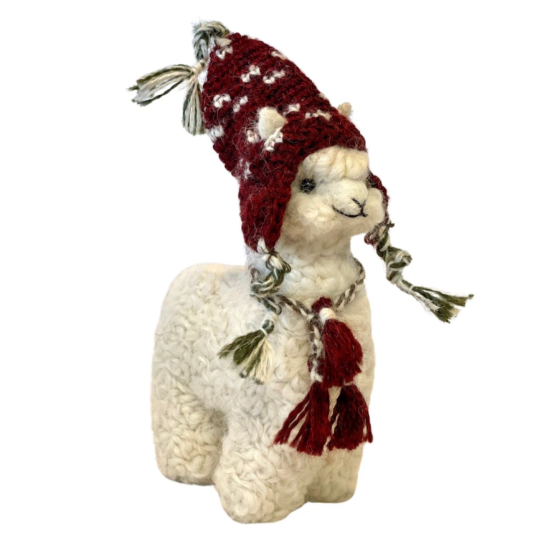 White alpaca ornament wearing a Chullo peruvian hat with green strings