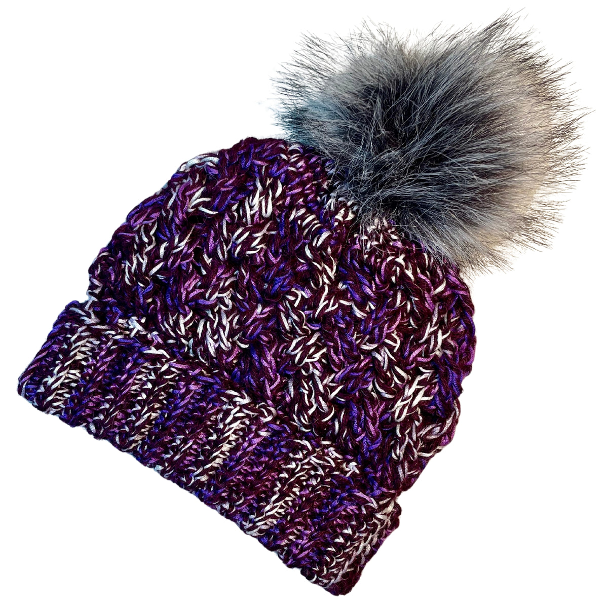 Deep purple, bright purple violet, and white colored cozy soft warm handmade knitted crochet celtic hat with a multi-gray pom pom made in Montana by Alpacas of Montana.