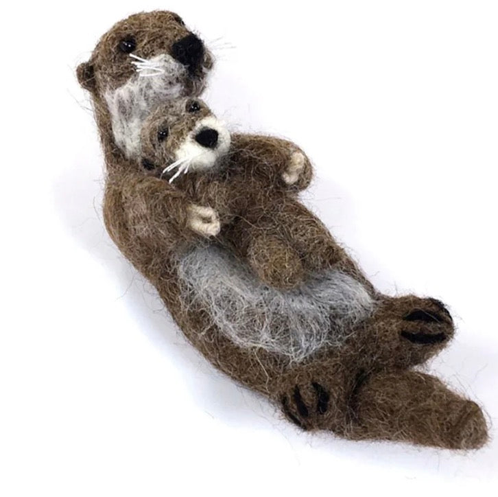 Felted alpaca ornament of an Otter holding a baby otter 