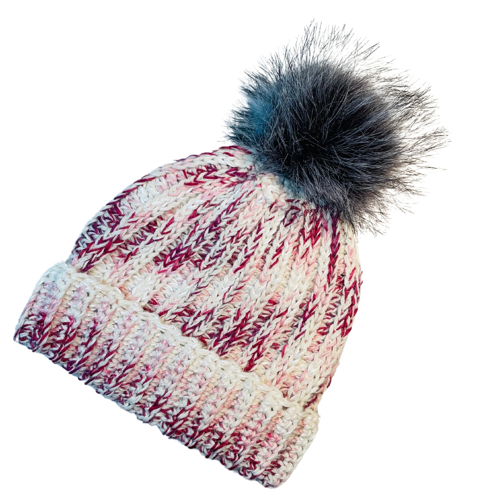 Fuchsia, dark pink, light pink, carnation, and white colored cozy soft warm handmade knitted crochet ridge ribbed hat with a multi-gray pom pom made in Montana by Alpacas of Montana.