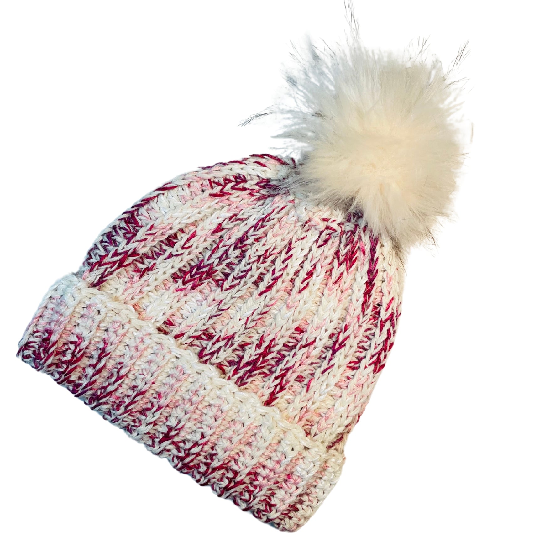 Fuchsia, dark pink, light pink, carnation, and white colored cozy soft warm handmade knitted crochet ridge ribbed hat with a white pom pom made in Montana by Alpacas of Montana.