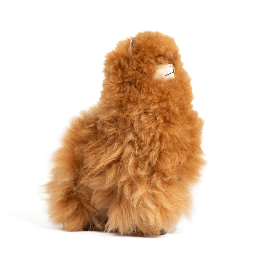 A plush brown fleece toy resembling an alpaca with beige fleece, black eyes, and a brown nose.