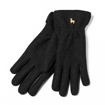A pair of black alpaca fiber gloves with extended wrist cuffs and a small gold alpaca logo on the cuffs.