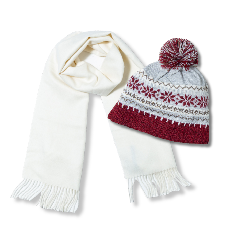 White scarf and red and gray patterned hat with pom-pom on a white background