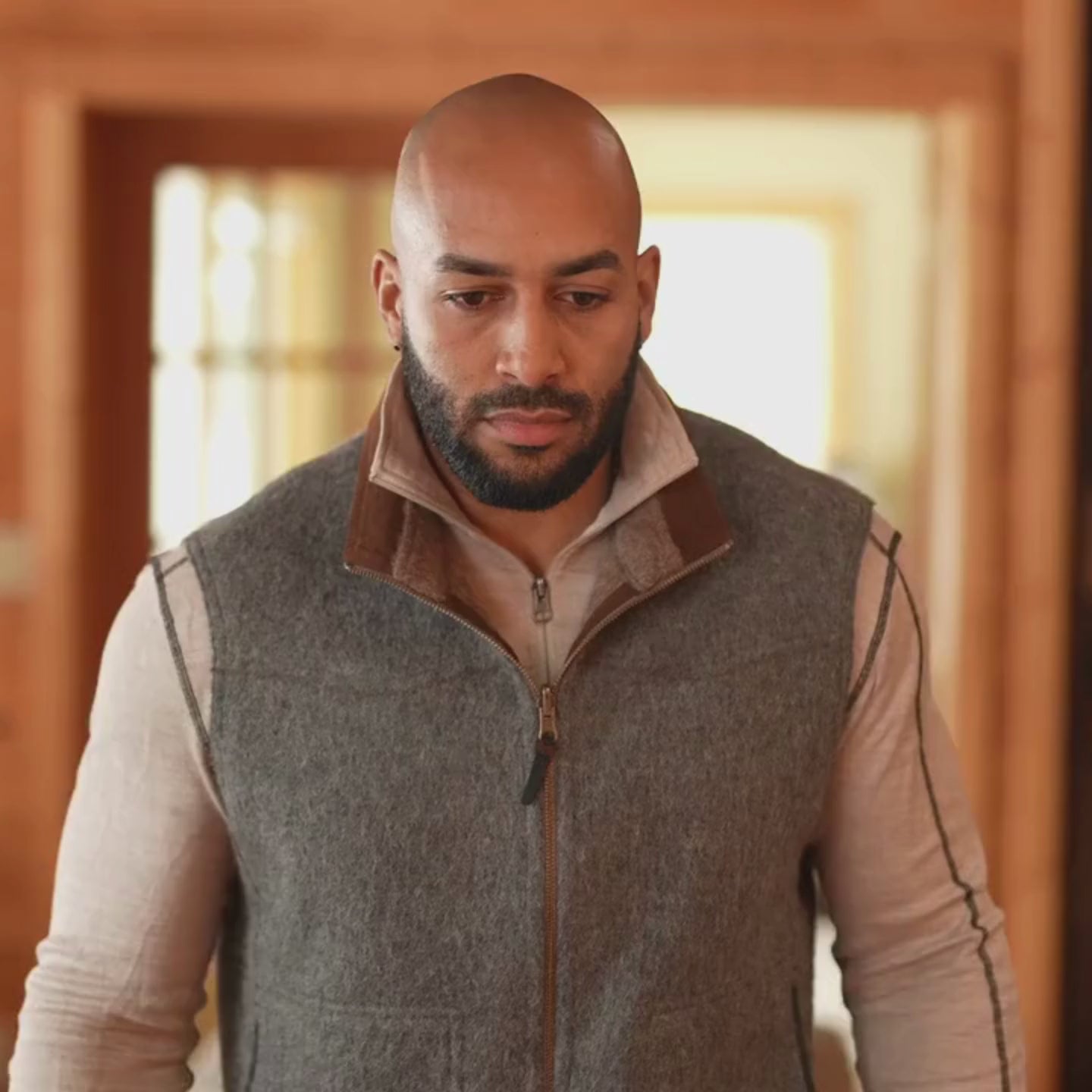 Video of man wearing reversible alpaca vest showing zipper and alpaca clothing