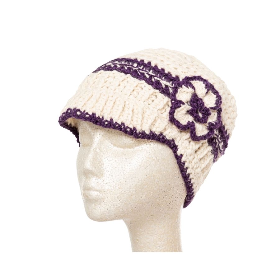 white and purple hand knit alpaca wool brimmed beanie hat with flower