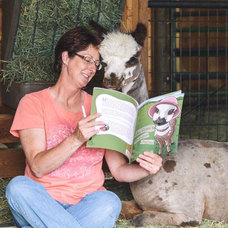 Kim and Rosie reading Miss Rosie's alpaca book