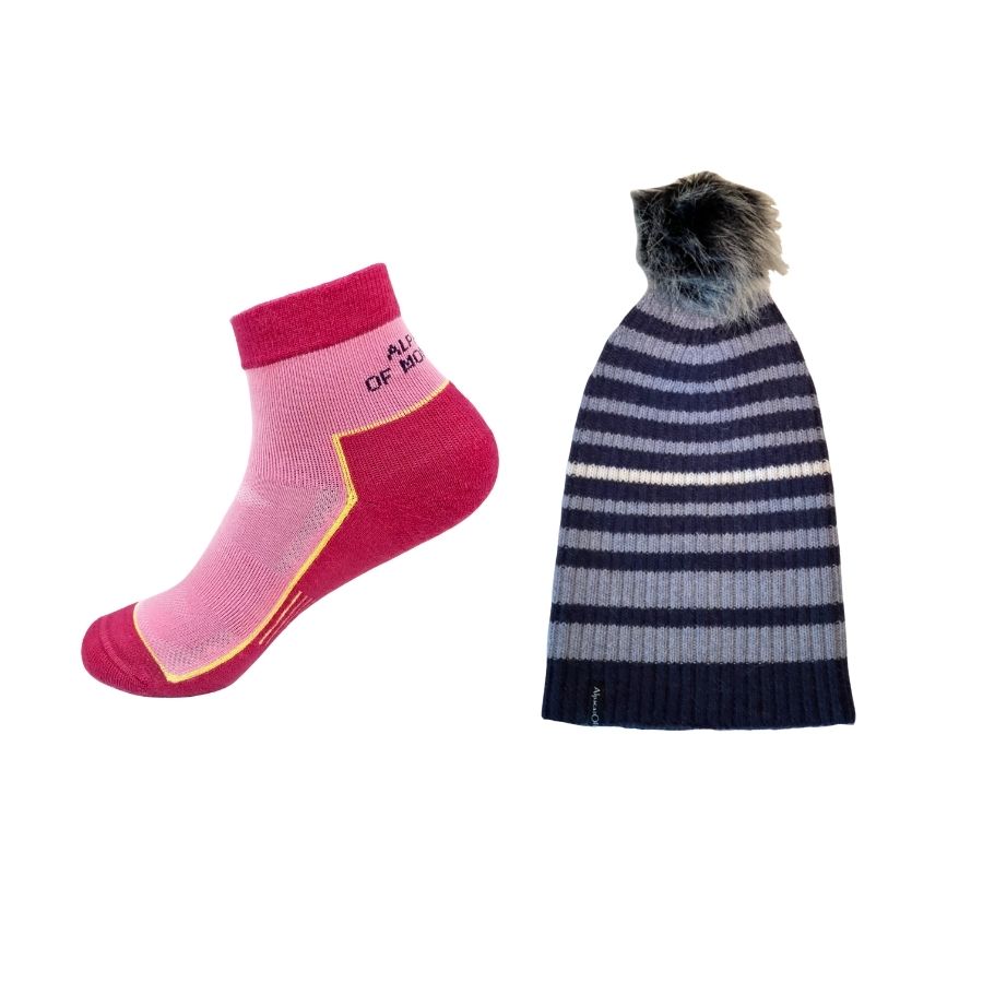 pink alpaca wool quarter socks and blue striped ribbed alpaca wool beartooth beanie with black and white pom pom 