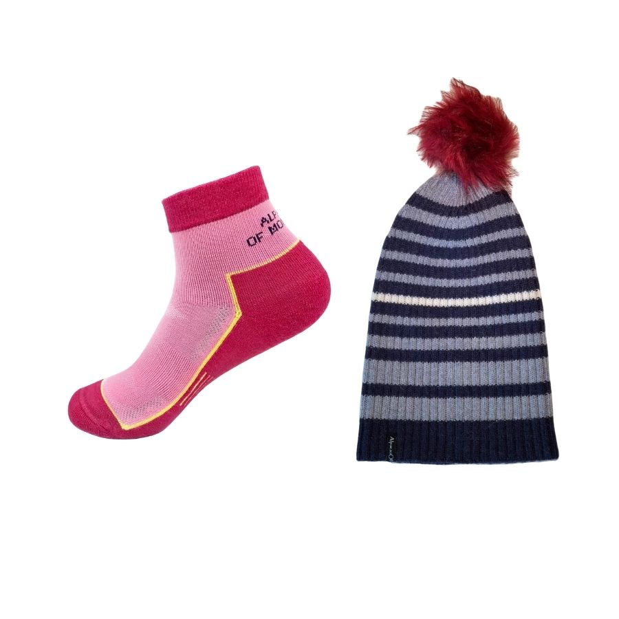pink alpaca wool quarter socks and blue striped ribbed alpaca wool beartooth beanie with red pom pom 
