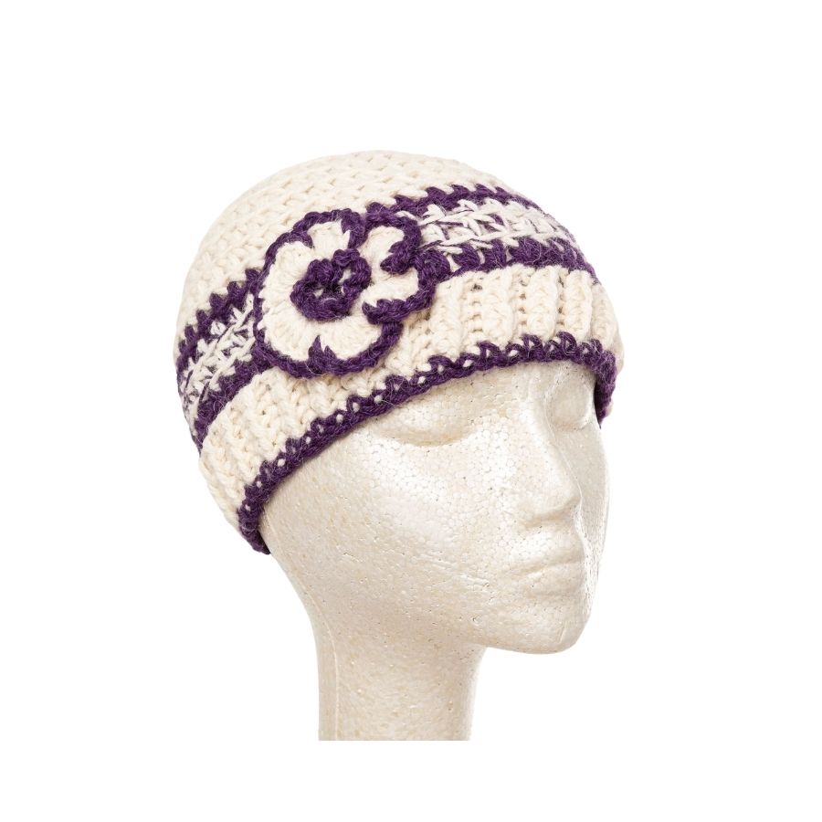 white and purple hand knit alpaca beanie hat with flower on mannequin head