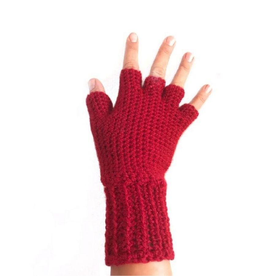 A product photo with a white background of a hand wearing a soft cozy comfortable fashionable moisture wicking knitted crochet fingerless gloves handmade in Montana from scarlet red alpaca wool yarn.