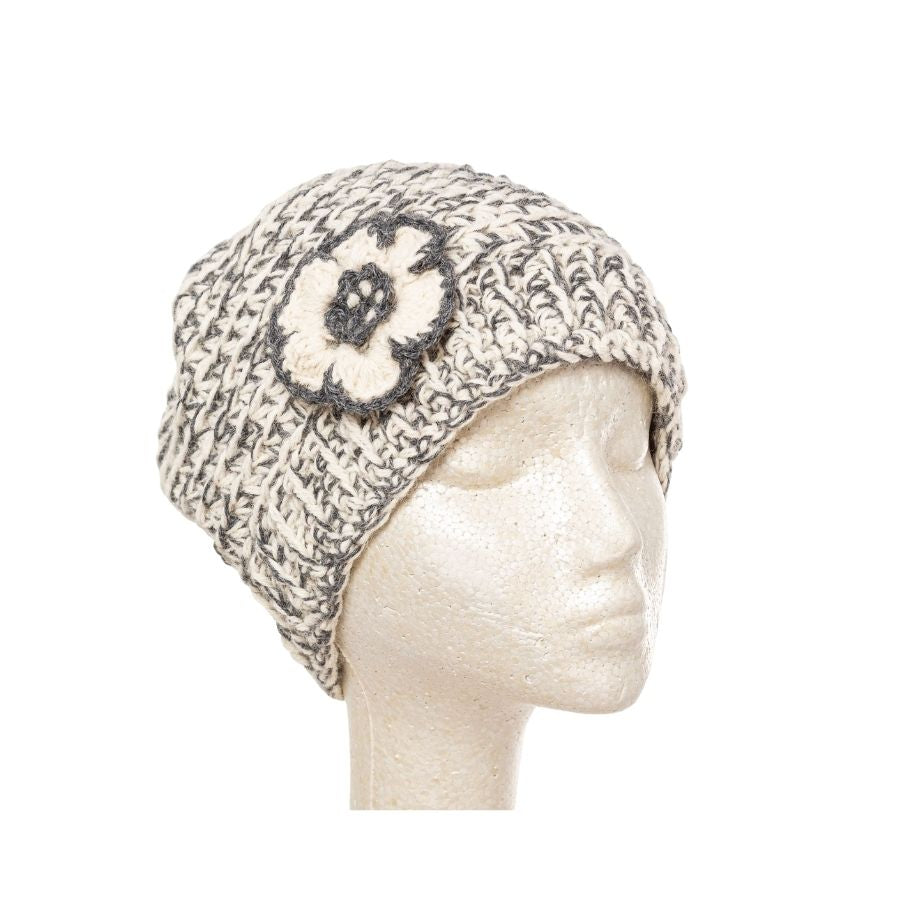 shades of gray hand knit alpaca beanie hat with flower on mannequin head