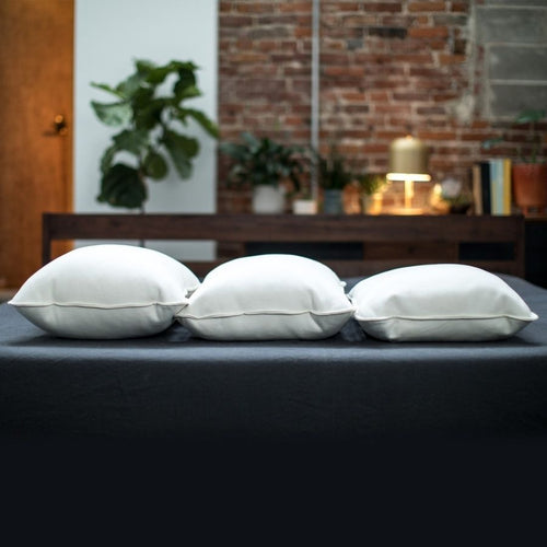 three alpaca fleece soft and cozy pillows going from king sized on the left, queen in the middle and standard on the right