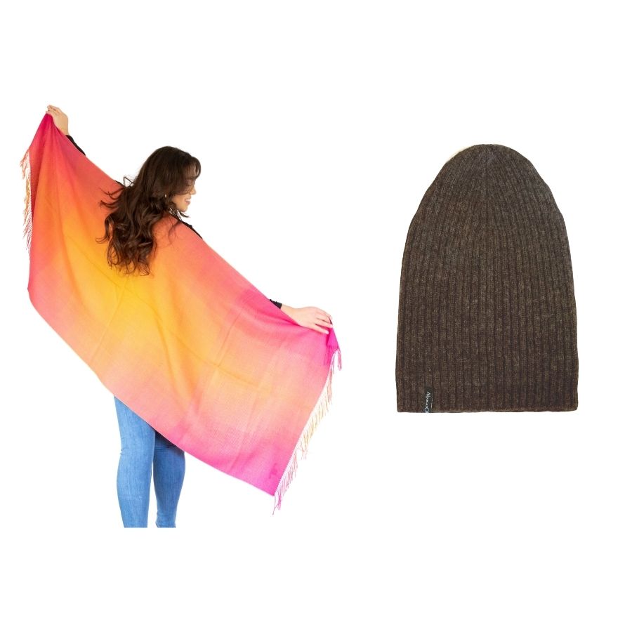 woman standing with her back to the camera and her arms extended wearing sunrise colored alpaca wool shawl and product photo of brown ribbed alpaca wool beartooth beanie hat